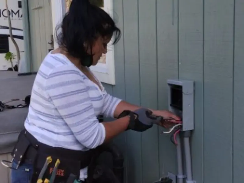 Licensed electrician wiring an exterior subpanel in Barnesville